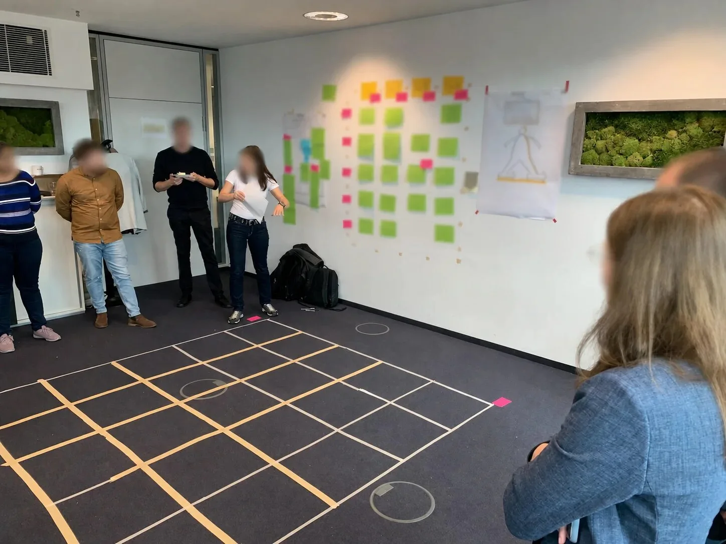 Workshop participants exploring a system marked out on the floor